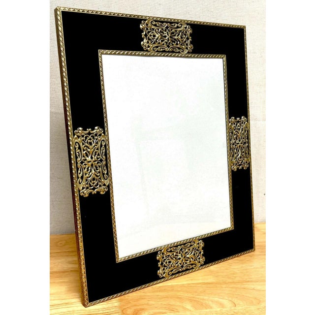 French Art Deco Gilt bronze & black enameled glass picture frame France, circa 1930s A glamorous large scale example of...