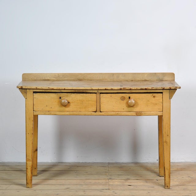 This characterful console table from circa 1930 is crafted from maple and pine wood and exudes an authentic, rustic look....