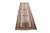 This traditional hand-knotted runner rug features an elongated ivory field anchored by a repeating, interconnected...