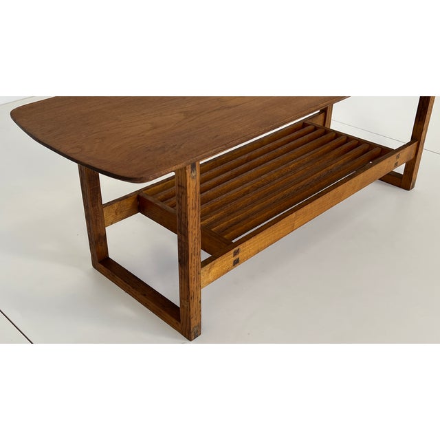 Stylish wooden bench in a deep dark brown. The cool, minimalist design contrasts beautifully with the warmth of the wood....