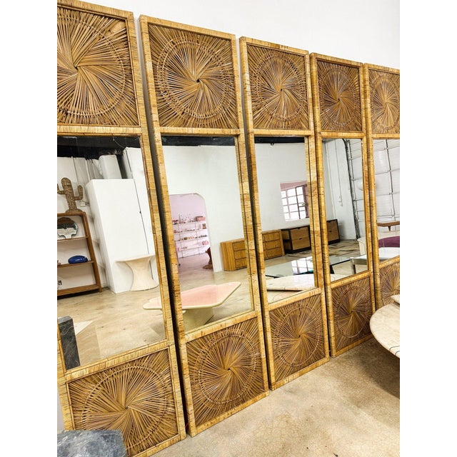 Incredible set of two sunburst rattan mirror panels, in amazing condition. A few pieces need to be glued back on the side,...