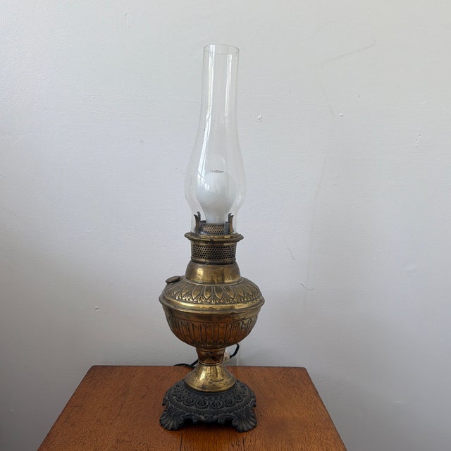 Elevate your space with this stunning late 19th-century Victorian-era parlor lamp. Beautifully transitioning history into...