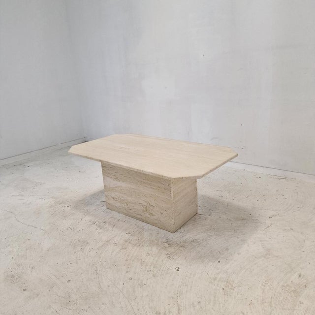 Very nice Italian coffee or side table, fabricated in the 1980s. It is handcrafted out of very beautiful travertine. It...