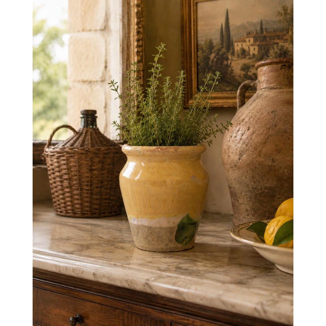 A hand thrown rustic glazed confit pot that has come from a home in France. It dates from the 19th century and shows its...