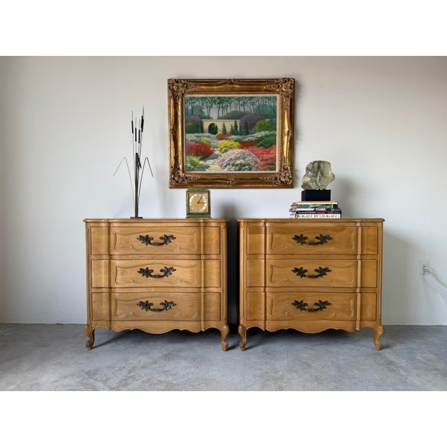 Beautiful pair of tall vintage French Provincial three-drawer chests crafted in solid cherry wood with cherry veneers,...