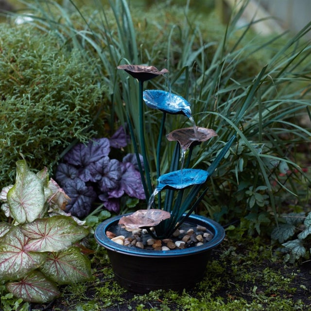 Enhance your home or garden with the tranquil beauty of the Bronze Metal Lotus Leaf Fountain. Designed for both indoor and...