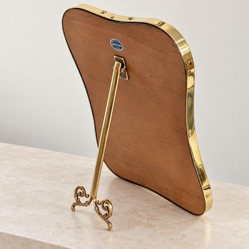 An elegant Italian table mirror from the 1950s, crafted from brass and attributed to Gio Ponti, featuring a highly iconic...