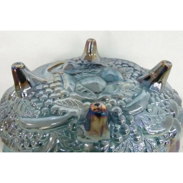 This magnificent Fruit/Centerpiece Bowl is made of carnival glass. This piece has brilliant vintage style; it features a...