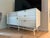 Attributed to Blu Dot Dang 1 door 3 drawer console. White painted oak veneer over engineered wood case, door, and drawers...