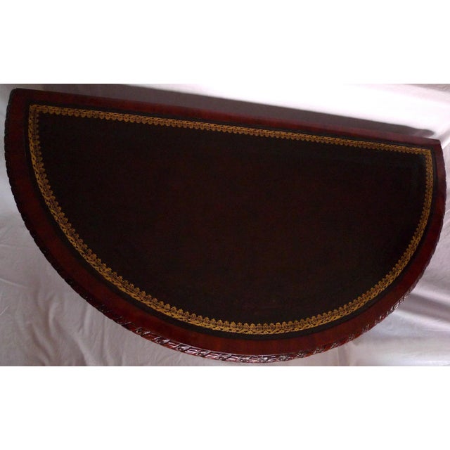 Title: Regency Console Table. Maker: Maitland-Smith. Material: Mahogany, satinwood, brass, leather. Model: 3431-040....