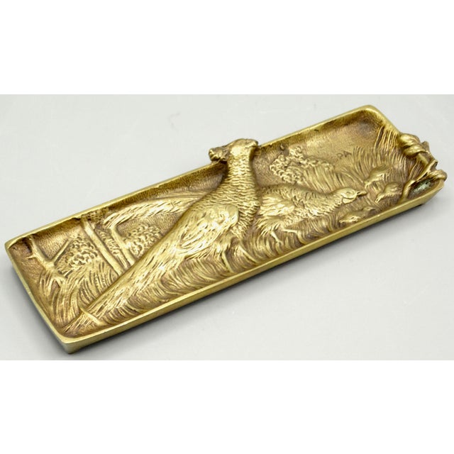 Circa 1890, fine quality gilded bronze pen tray made in Spa, Belgium. It is well cast solid bronze with lovely high relief...