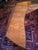 Dramatic long mid-century coffee table crafted of exquisitely composed rosewood burled wood, set in walnut bezel. Coloring...