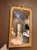 Large French giltwood Louis Philippe mirror featuring a classic rectangular form with softly rounded upper corners,...
