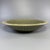 Fine antique Chinese celadon charger plate. Wide shallow form decorated with raised relief dragon motif at center, ribbed...