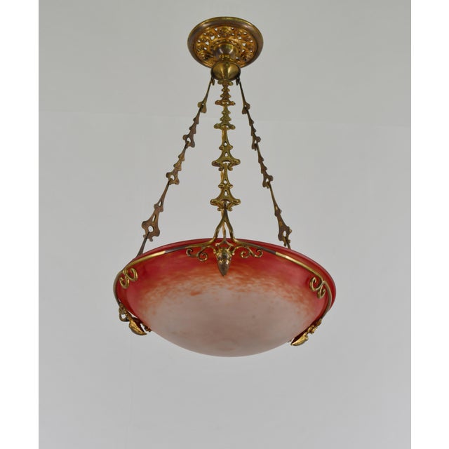Charles Schneider A 1925-1930 French art deco 3-armed pendant light in gilded bronze or solid brass holding a nice...
