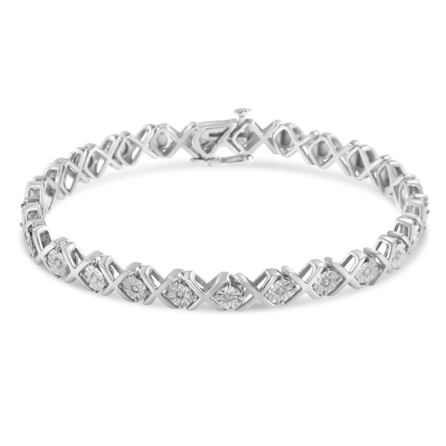 A gorgeous sterling silver diamond accent tennis bracelet, perfect for your jewelry collection. This stunning piece is...