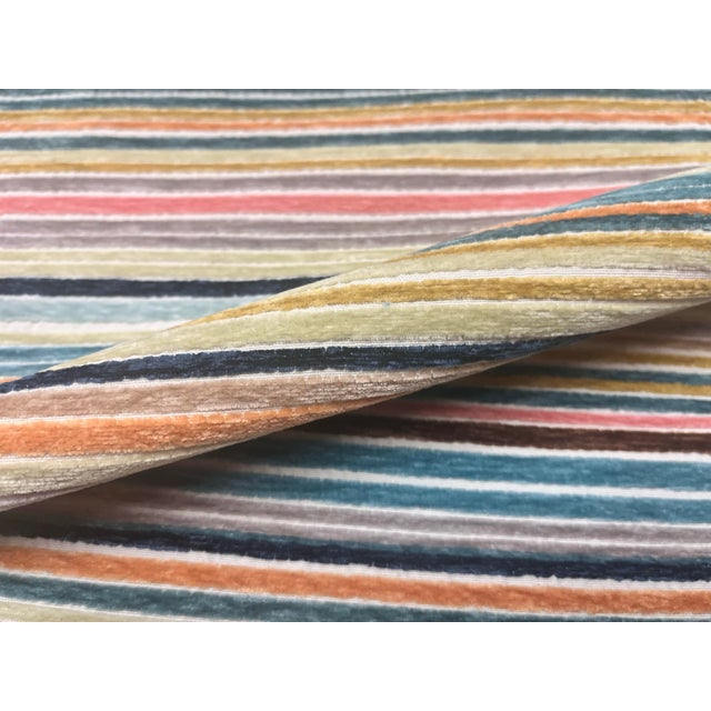 58” wide upholstery fabric in navy blue, cream, coral, teal, brown, mustard gold and other colors with a stripe pattern...