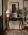 This vintage mahogany demi-lune entryway table features a graceful serpentine front, long cabriole legs, and carved shell...