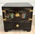 Here is a vintage Chinese Chinoiserie black lacquer nightstand, side cabinet dating to the mid-20th century. The cabinet...