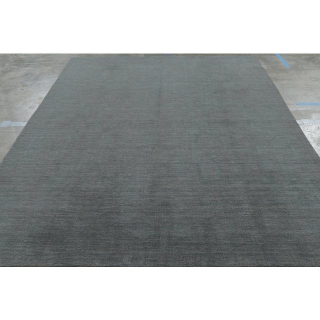 Hand-knotted in wool, this 8x10 rug is a bold new addition to Rug & Kilim’s Textural Collection, with an impressive use of...
