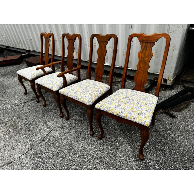 These chairs are constructed of a solid straight grained oak. They're fashioned in the Queen Anne style. They have...