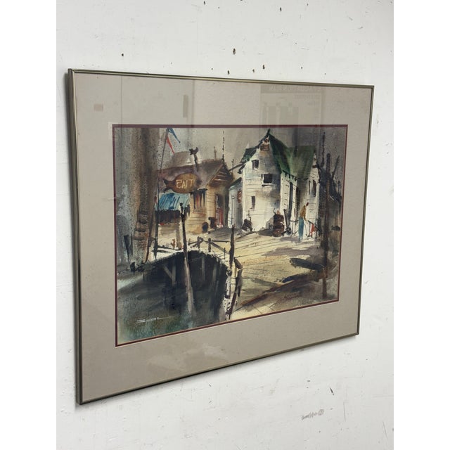 Design Plus Gallery presents Fishing Wharf, a Signed + Framed Watercolor by Kenneth Siqueira (1922 - 2009). This coastal...