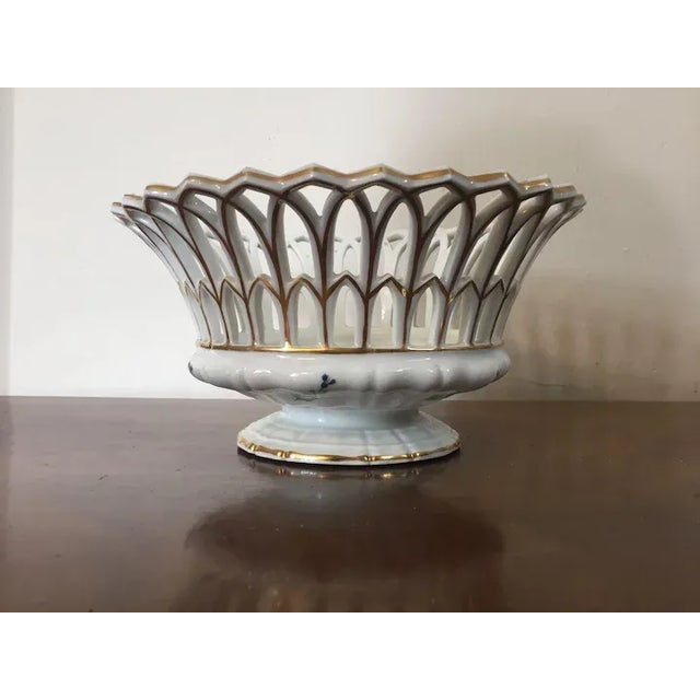 Antique early 19th c. Paris porcelain reticulated basket decorated with sprig cornflower. Measures 9 3/4" diameter x 5...
