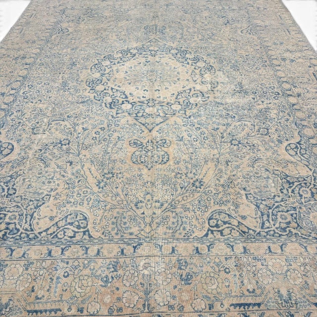 An exceptional antique Meset rug distinguished by an extraordinarily intricate floral design arranged around a small...