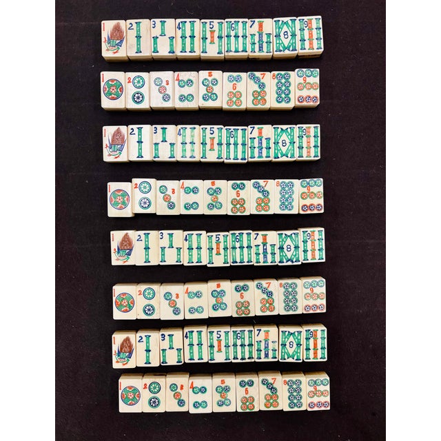 This vintage mahjong set from China contains 144 tiles, 4 blanks, a wind bettor, 4 dice and 116 counters. The mahjong are...