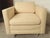 Square lounge chair with high arms and chrome feet. Large soft cushioning, beige upholstery. No maker's mark. (Please...