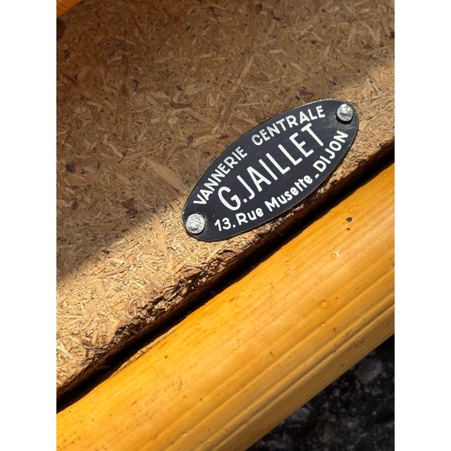 This vintage coffee table from the 1960s perfectly embodies the retro charm and natural elegance of rattan and bamboo...