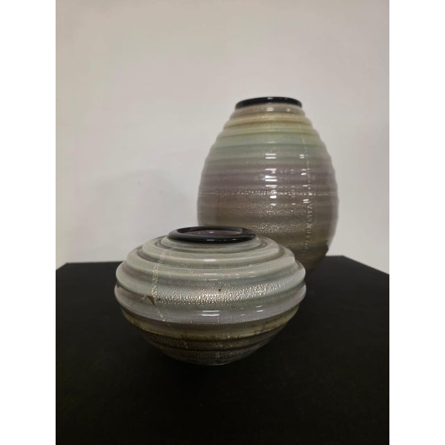 Pair of Seguso Murano Vases. Refined vases in multicolored sommerso glass paste with silver inclusions. Black glass paste...
