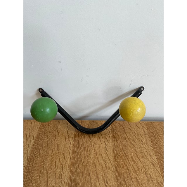 Add a pop of French Mid-Century design to your entryway, bedroom, or bath with this iconic Sputnik-style wall hook....