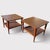 This matched pair of Lane end tables, Style No. 1038-18, was produced in 1963 and features walnut frames, woodgrain...
