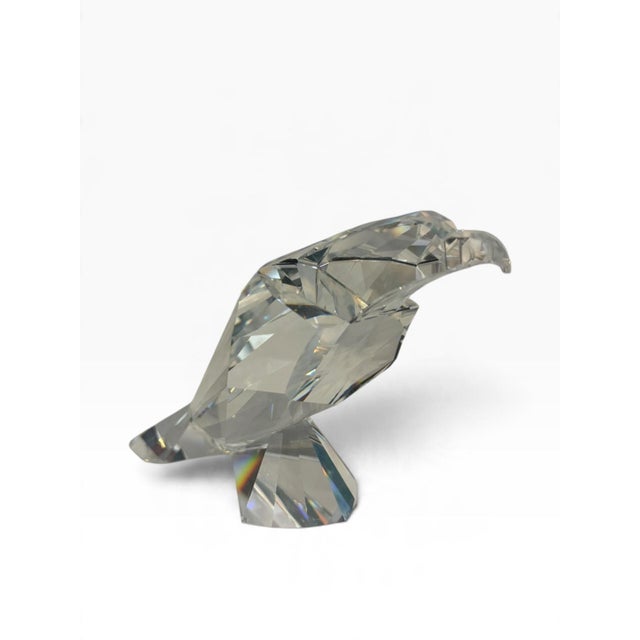 Retired Swarovski crystal eagle from the Symbols collection ('The Eagle,' #624599). The design reduces the bird to bold,...
