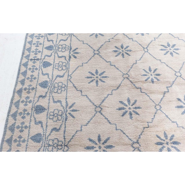 Elevate your interiors with the refreshing elegance of this Modern Moroccan Hand-Knotted Wool Rug, a timeless piece that...