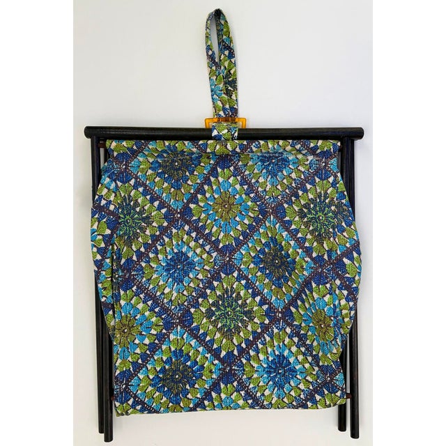 This vintage folding yarn caddy for knitting, crocheting or sewing projects with attached carry handle. Bright printed...