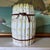 A charming vintage Italian majolica lidded jar modeled as a bundled stack of asparagus, tied with rustic brown vines....