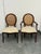 Design Plus Gallery presents a Pair of Traditional Oval Cane-Back Chairs from The Bombay Company. The set includes one...