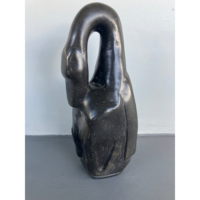 This is rare very large Shona sculpture of a resting bird carved out of mottled black serpentine or springstone. The piece...