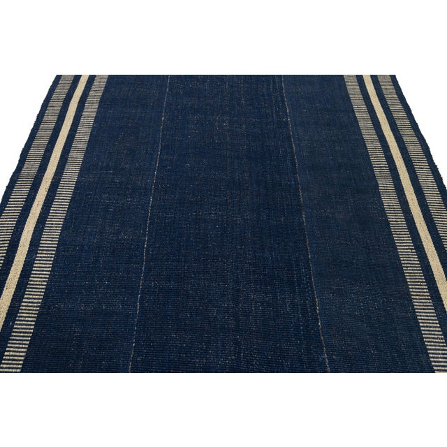 Enhance your space with this Modern Kilim-inspired wool rug. Hand-crafted for texture and durability, it features a rich...