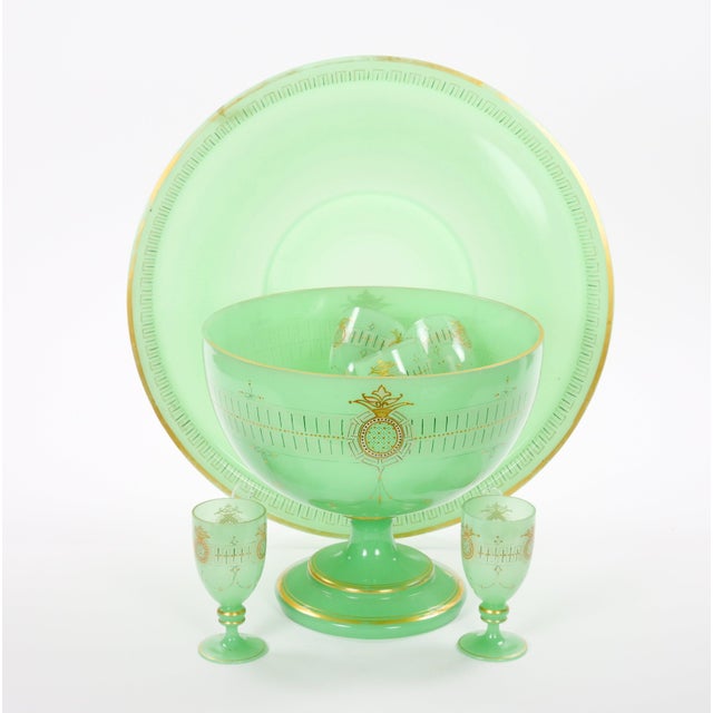 A magnificent antique French green opaline Baccarat crystal punch bowl service dating to the mid-to-late 19th century,...