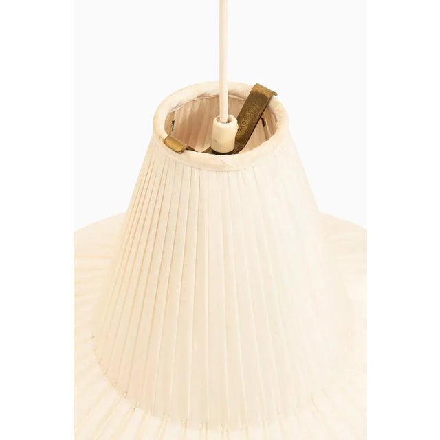 Height adjustable ceiling lamp in brass, white lacquered and original lamp shade by hans bergström additional information:...