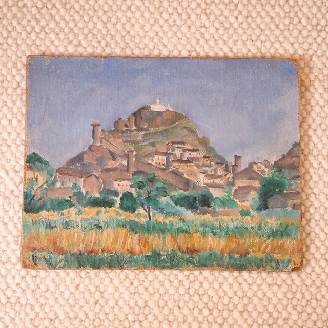 20th Century French Hilltop Church Painting by Guy Lemm, depicting a sunlit village nestled beneath a hillside church with...