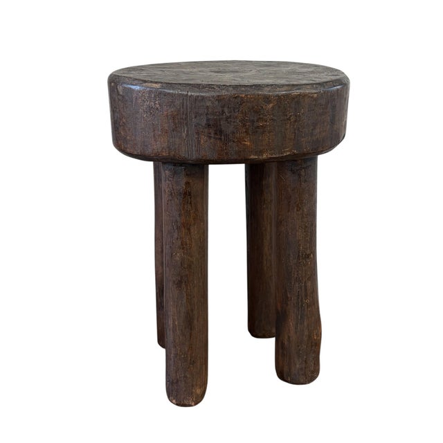 This stunning vintage African wooden milk stool, skillfully crafted by the Hehe Gogo people in Tanzania from one piece of...