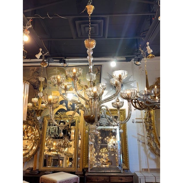 The Large Scale 2 Tier Murano Glass Chandelier in Fume Glass is a stunning lighting fixture designed in a chandelier...