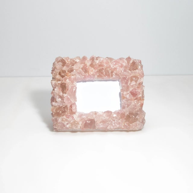 This Kathryn McCoy frame, adorned with pink quartz crystals, is a perfect blend of elegance and natural beauty. The frame...
