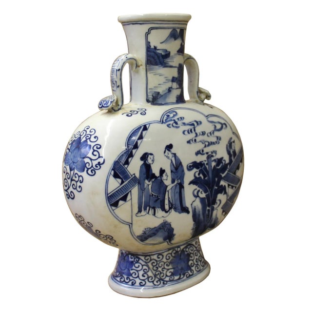 This is a Chinese decorative porcelain vase in Blue and White color finish. The theme is oriental people scenery graphic....