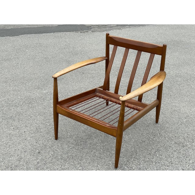 Classic easy chair in teak, designed by the renowned Danish designer Grete Jalk in the 1960s. Known for her elegant and...