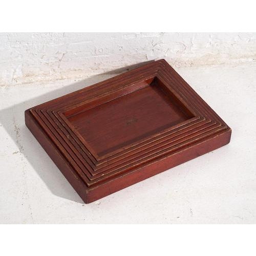 This set of antique Japanese wooden serving trays consists of seven pieces crafted in solid stained wood, produced in...